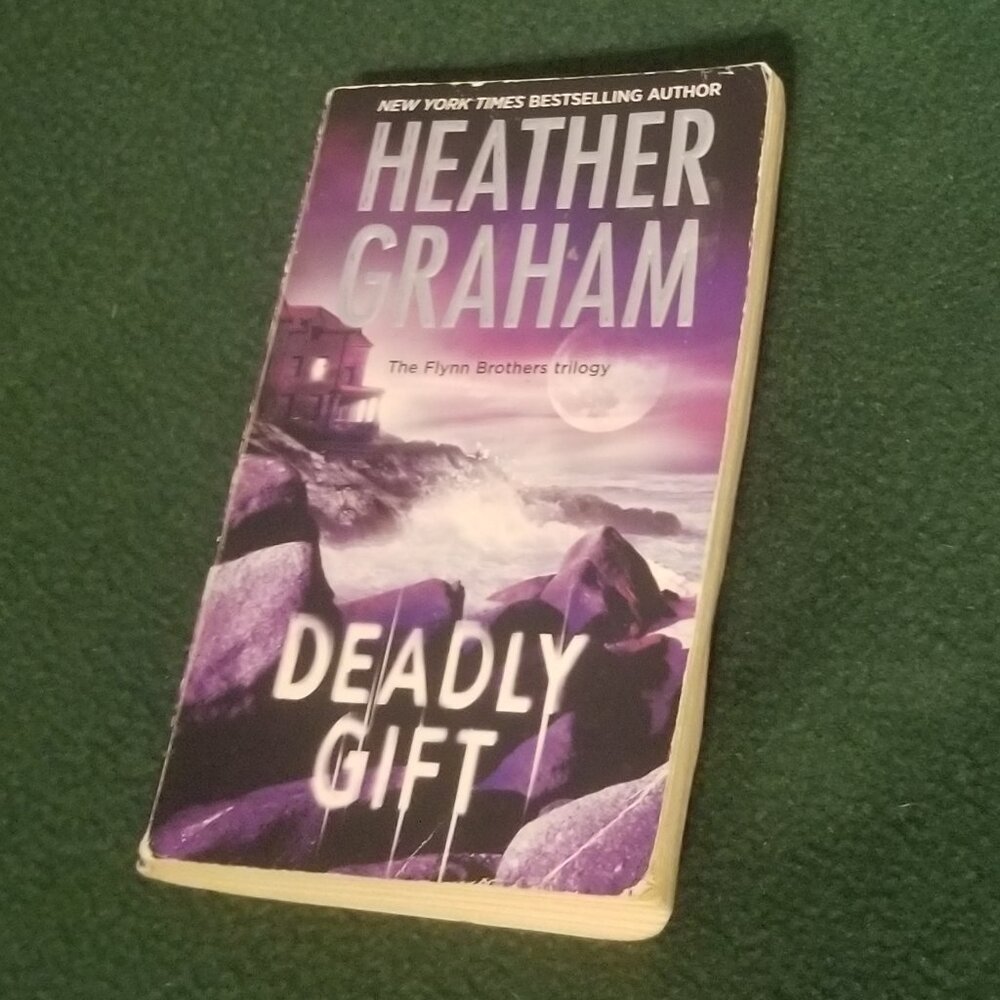 Heather Graham's Deadly Gift paperback, well worn